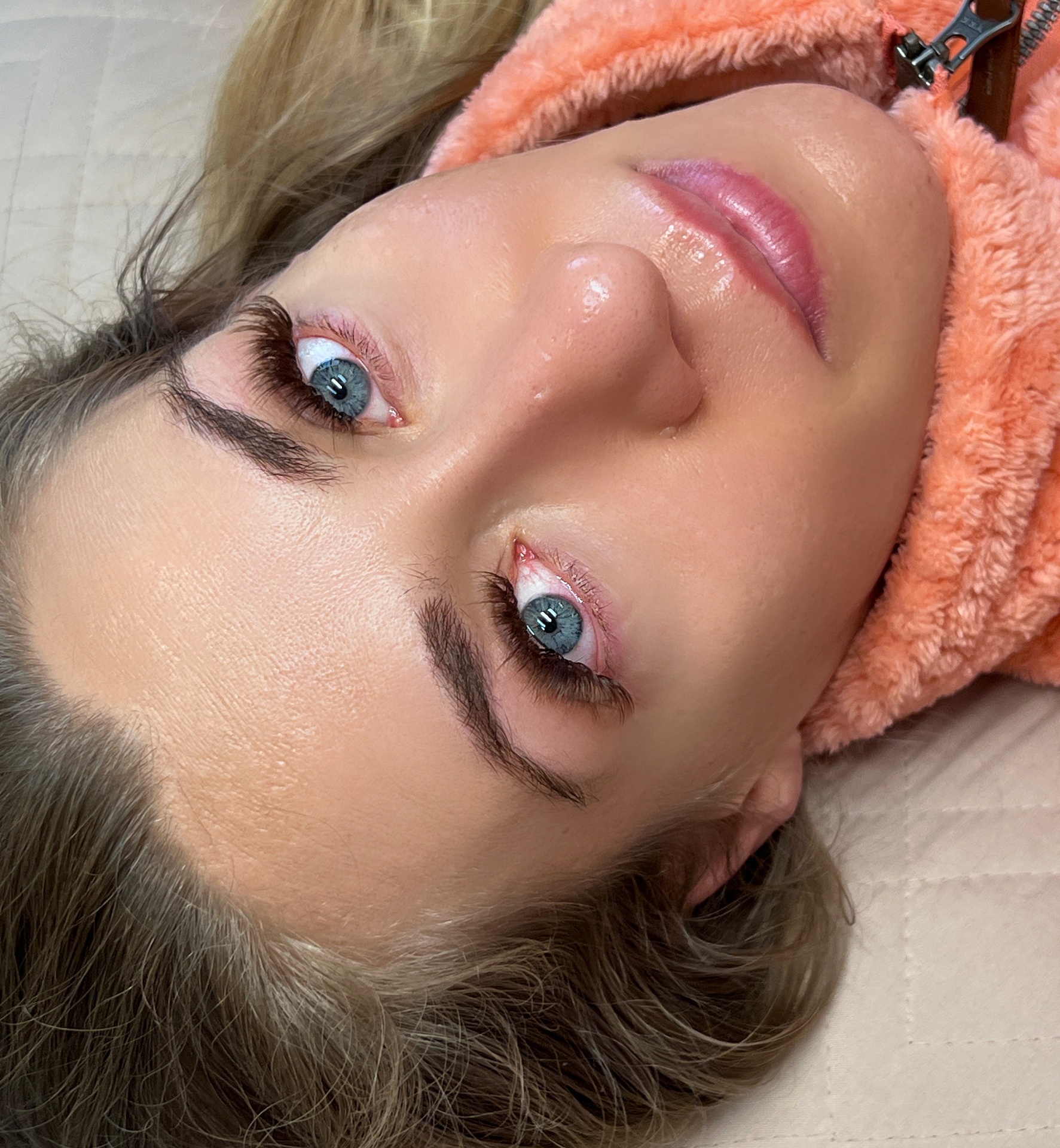 Brown lash extensions accentuating blue eyes by Luxe Lashes Dallas